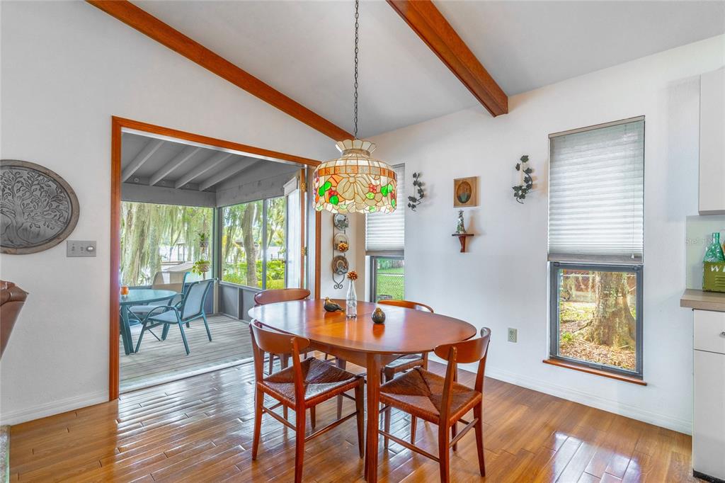 121 North Lake George Drive Georgetown, FL 32139 - Photo 20 of 46 a dining room with furniture potted plants and wooden floor