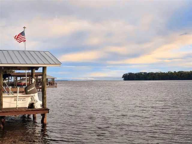 a view of a lake with a yard