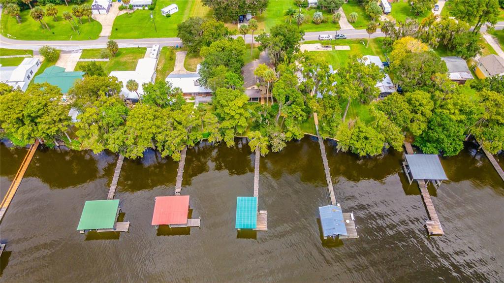 121 North Lake George Drive Georgetown, FL 32139 - Photo 39 of 46 a backyard of a house with table and chairs