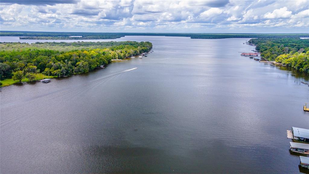 121 North Lake George Drive Georgetown, FL 32139 - Photo 42 of 46 a view of a lake with a street from a bench