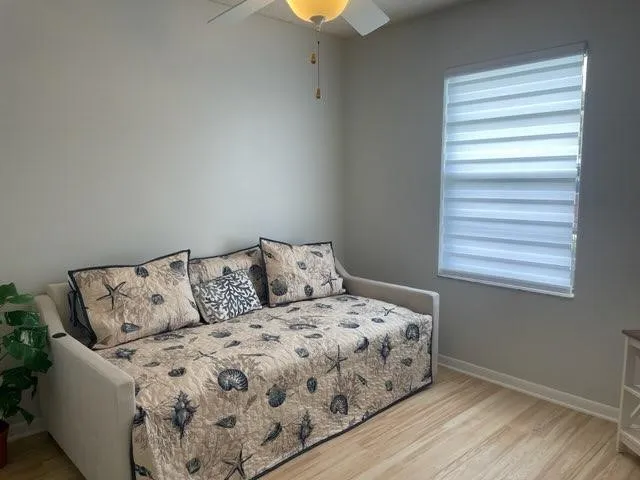 a bedroom with a bed and window