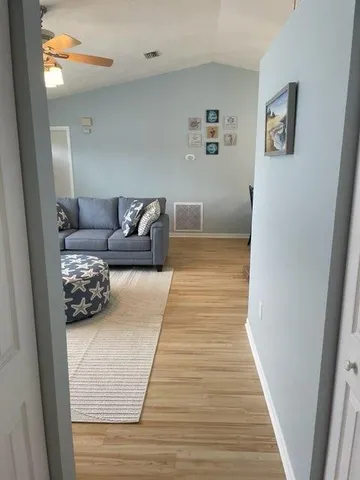 a bedroom with furniture and a rug