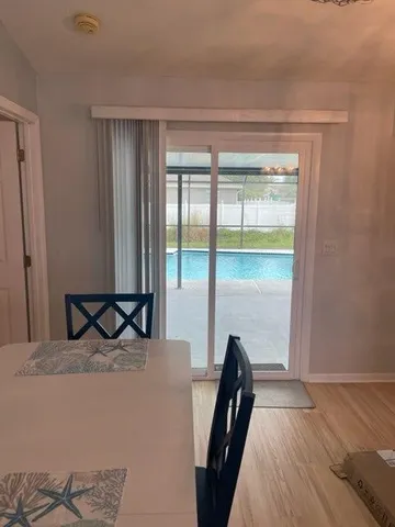 a bedroom with a bed and large window