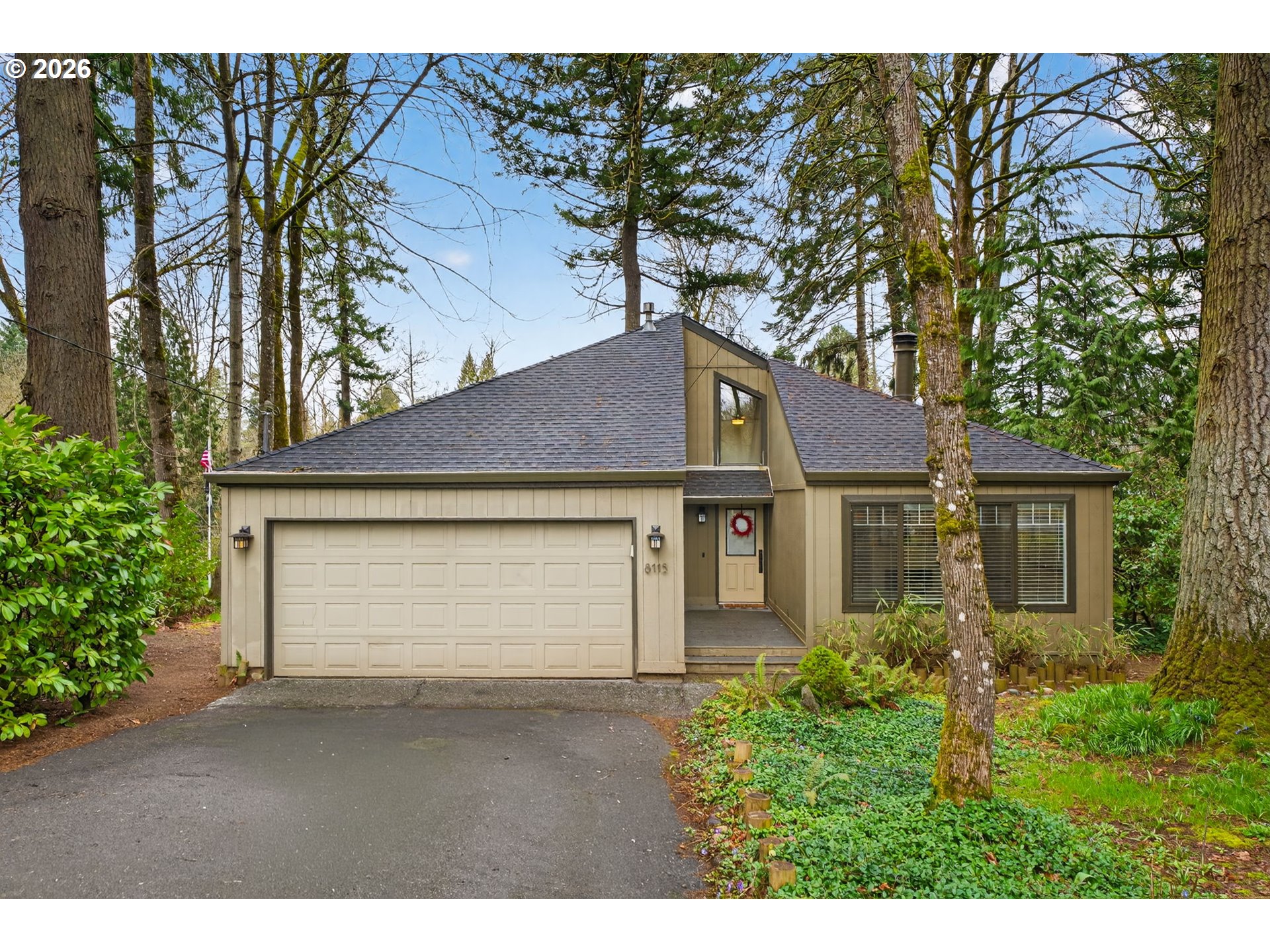 8115 Southwest Hemlock Street Portland, OR 97223 - Photo 1 of 36 a front view of a house with a yard and garage