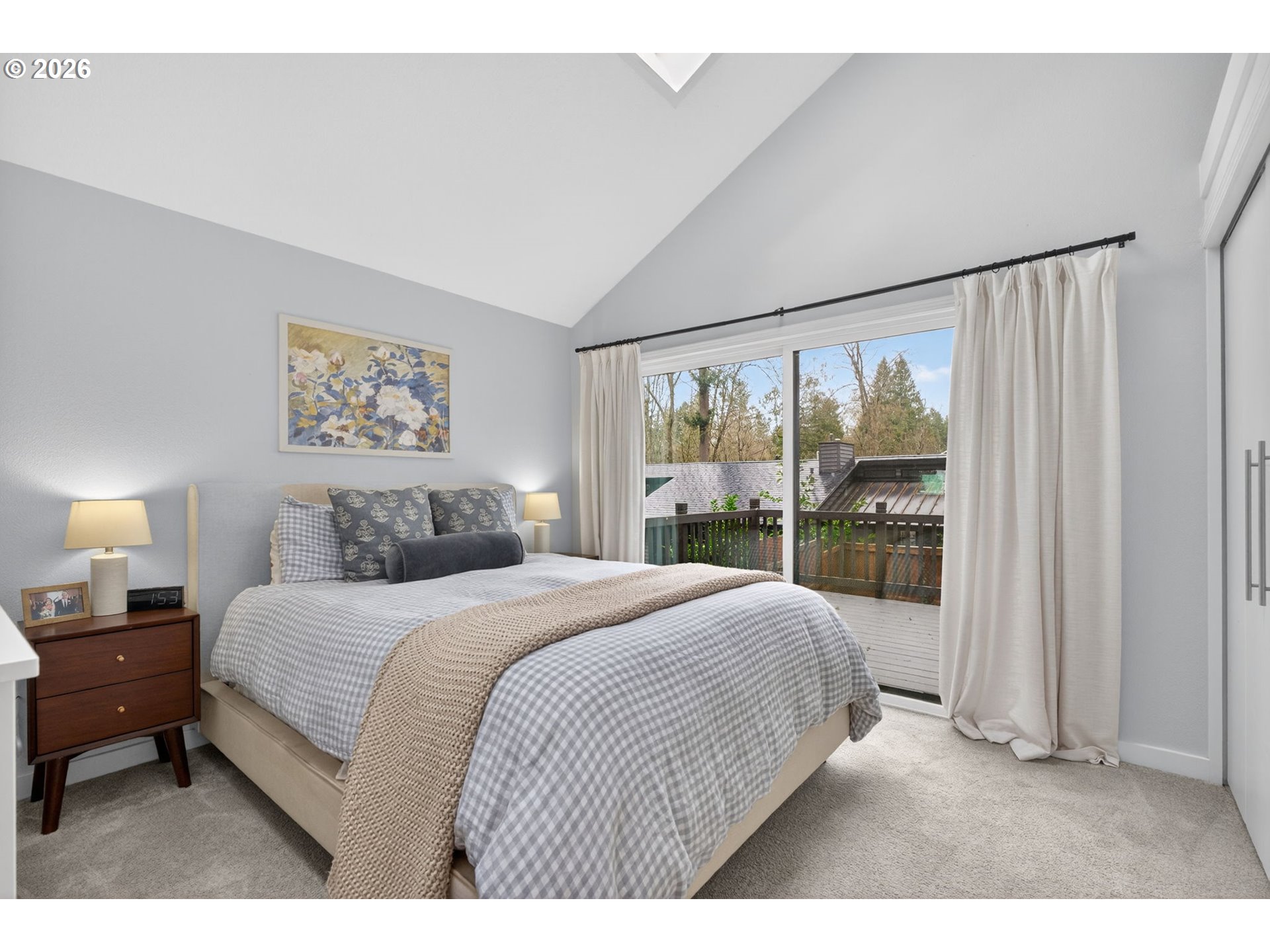 8115 Southwest Hemlock Street Portland, OR 97223 - Photo 14 of 36 a bedroom with a large bed and a large window