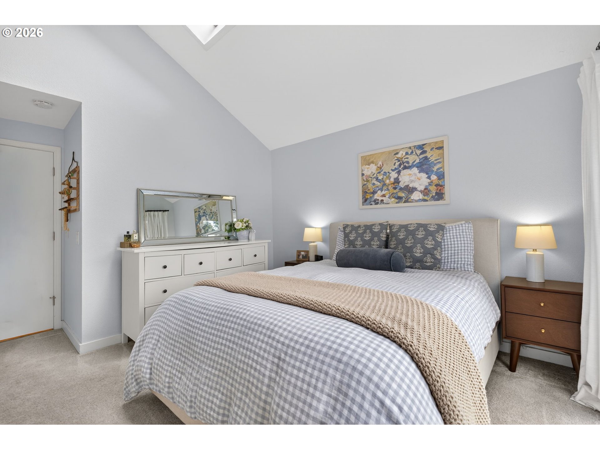 8115 Southwest Hemlock Street Portland, OR 97223 - Photo 15 of 36 a bedroom with a bed and a painting on the wall