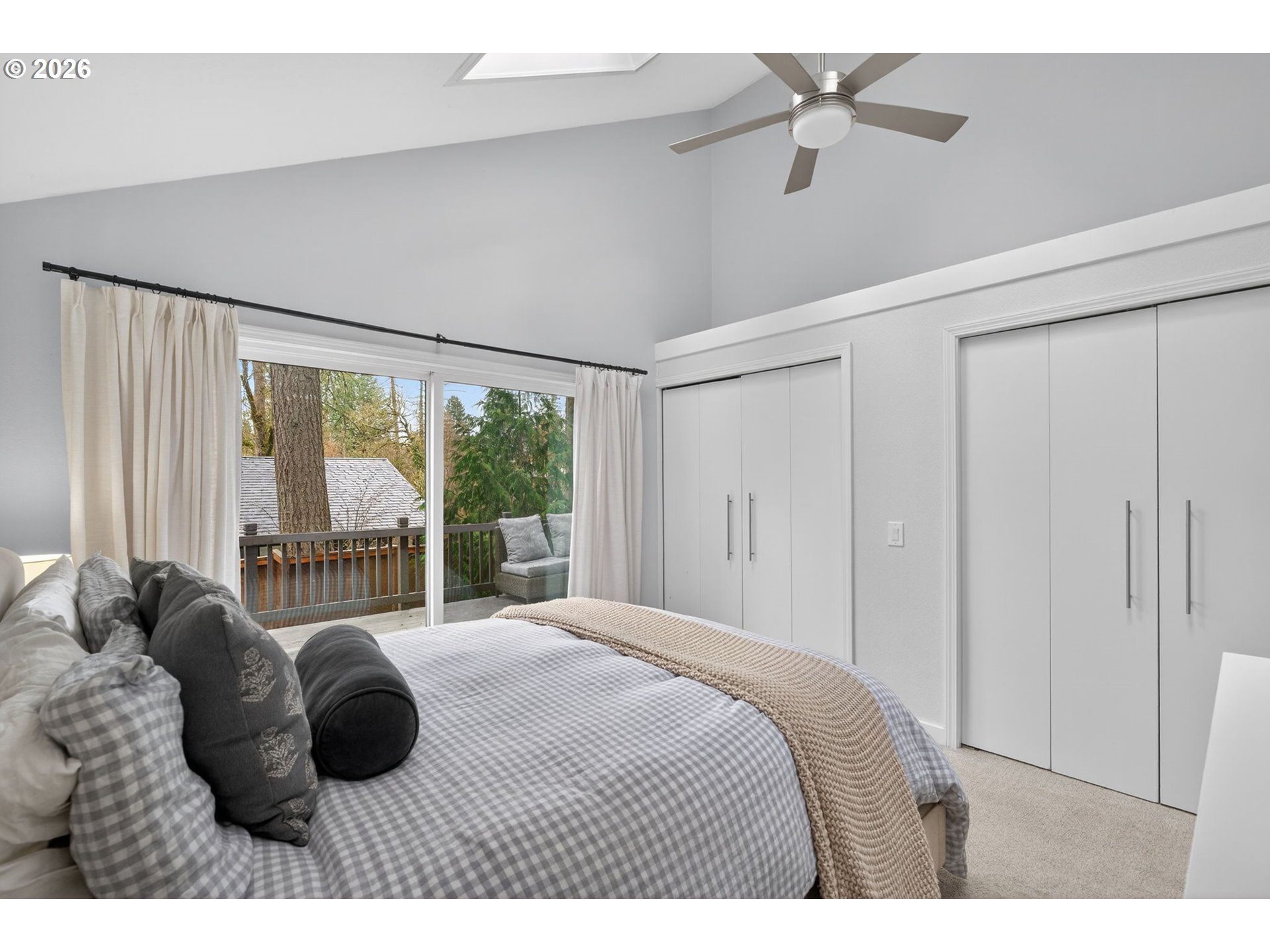 8115 Southwest Hemlock Street Portland, OR 97223 - Photo 16 of 36 a bedroom with a bed and a large window