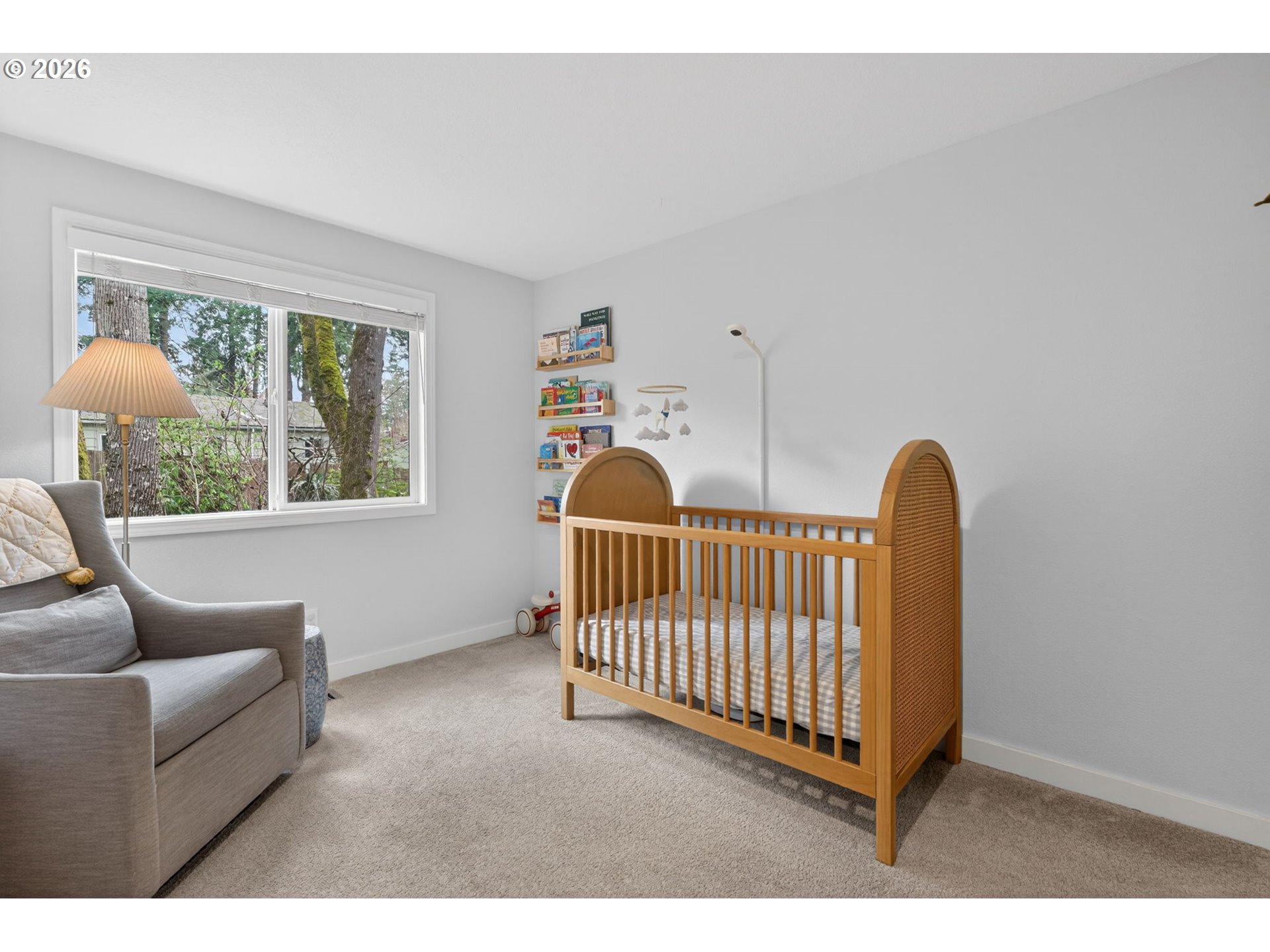 8115 Southwest Hemlock Street Portland, OR 97223 - Photo 20 of 36 a bedroom with a bed and a large window