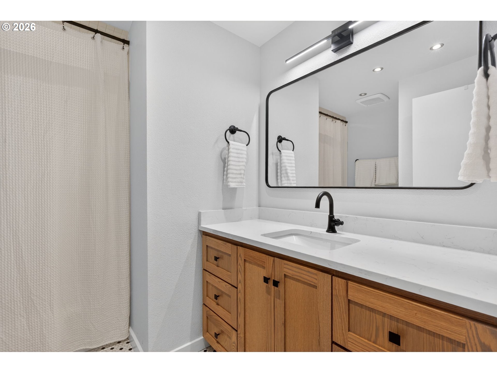 8115 Southwest Hemlock Street Portland, OR 97223 - Photo 25 of 36 a bathroom with a sink and a mirror