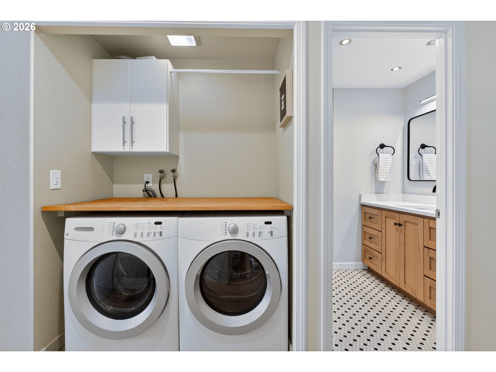 8115 Southwest Hemlock Street Portland, OR 97223 - Photo 26 of 36 a view of a hallway with washer and dryer