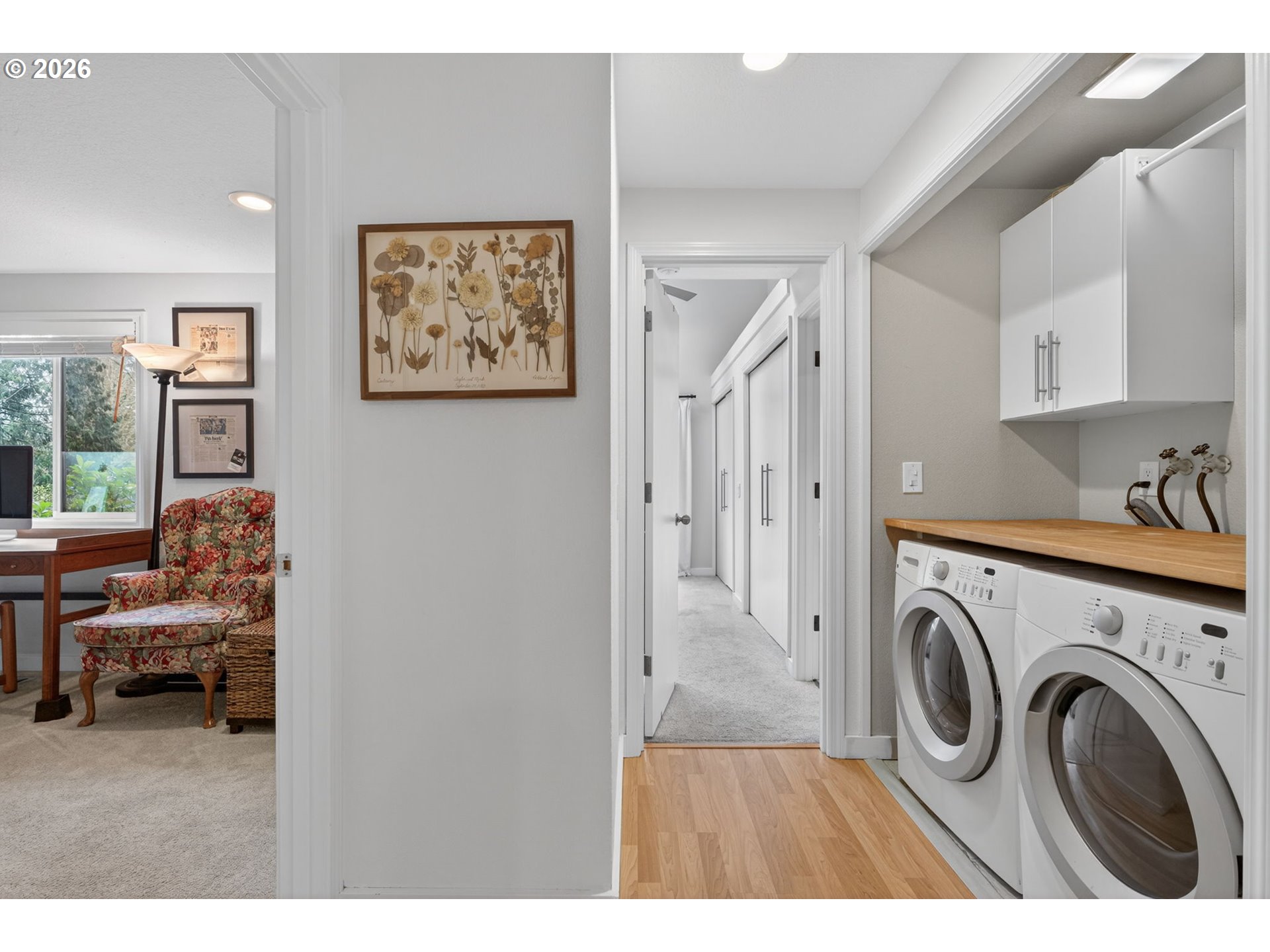 8115 Southwest Hemlock Street Portland, OR 97223 - Photo 27 of 36 a view of a livingroom with washer and dryer