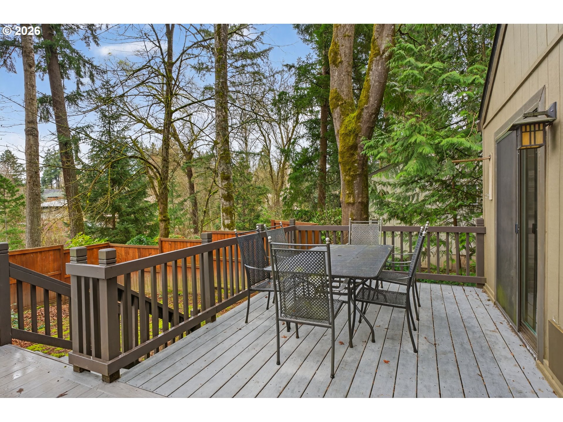 8115 Southwest Hemlock Street Portland, OR 97223 - Photo 29 of 36 a view of balcony with furniture and trees