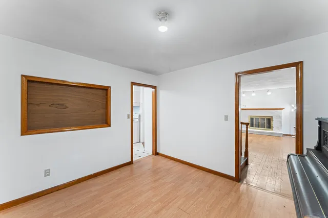 wooden floor in an empty room and a window