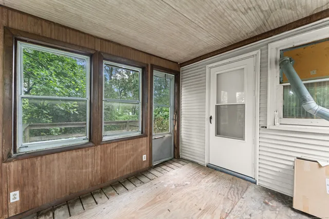 a view of a room that has a large window