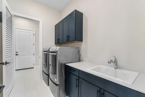 a view of a lake with a big yard and large trees