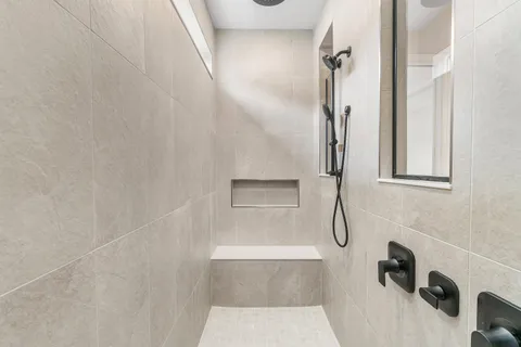 a view of a road with a large trees