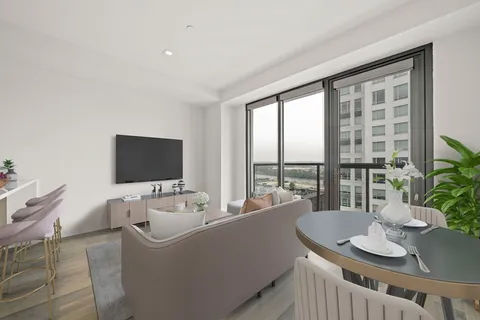 a living room with furniture and a flat screen tv