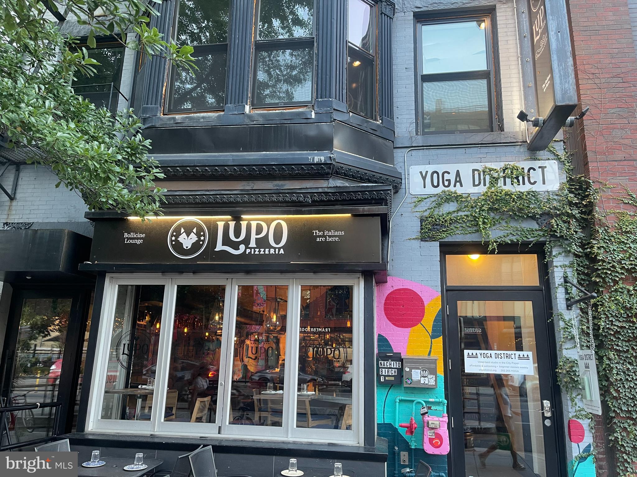 2120 Vermont Avenue Northwest, Unit 620 Washington, DC 20001 - Photo 58 of 69 a front view of multi story residential apartment building with retail shops