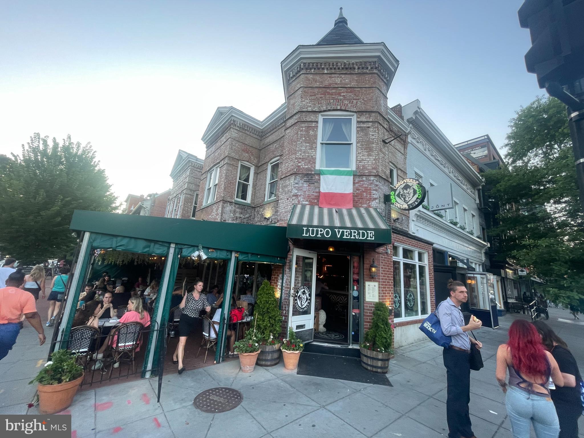 2120 Vermont Avenue Northwest, Unit 620 Washington, DC 20001 - Photo 59 of 69 a view of people sitting in front of retail shop