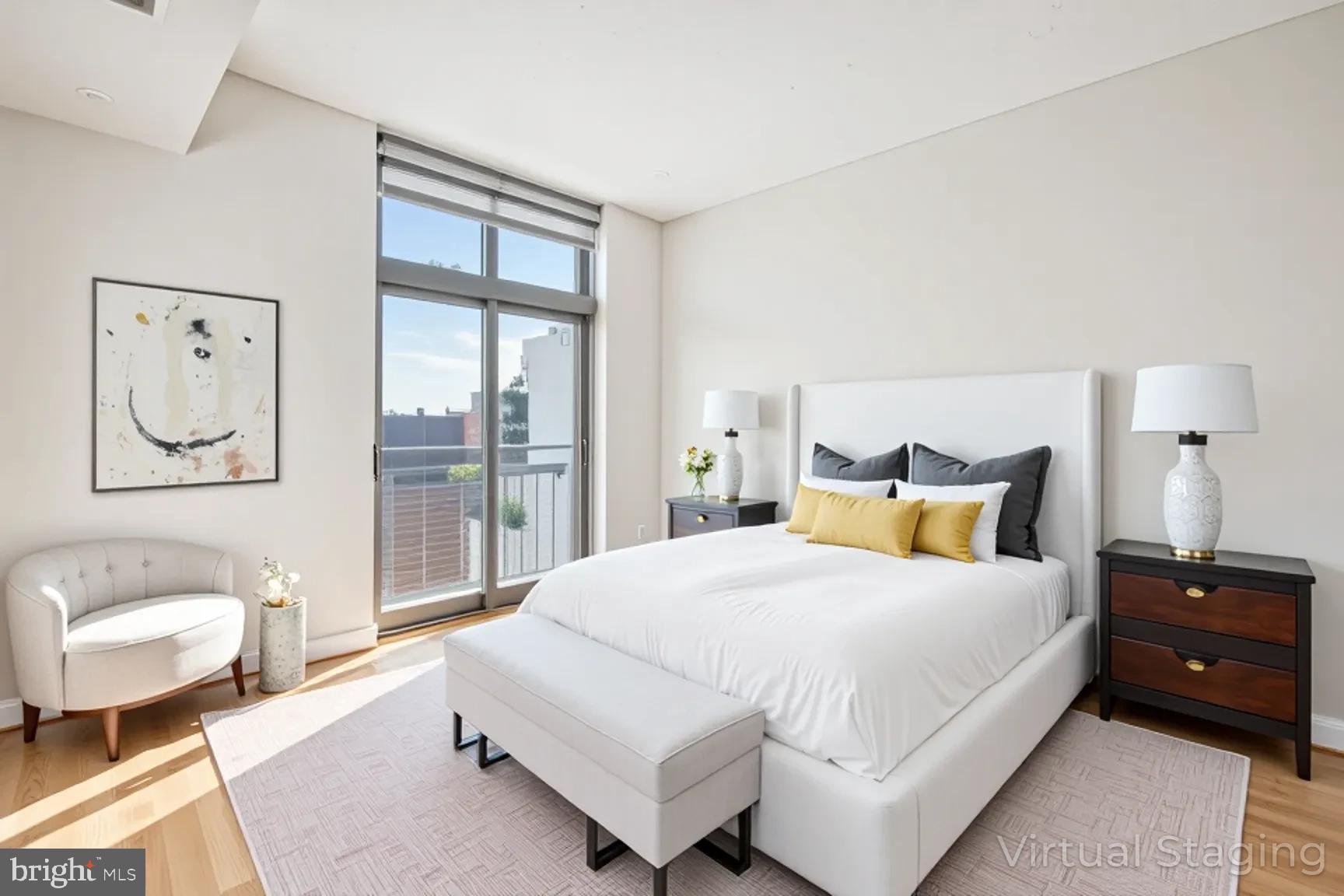 2120 Vermont Avenue Northwest, Unit 620 Washington, DC 20001 - Photo 8 of 69 a spacious bedroom with a bed and glass window
