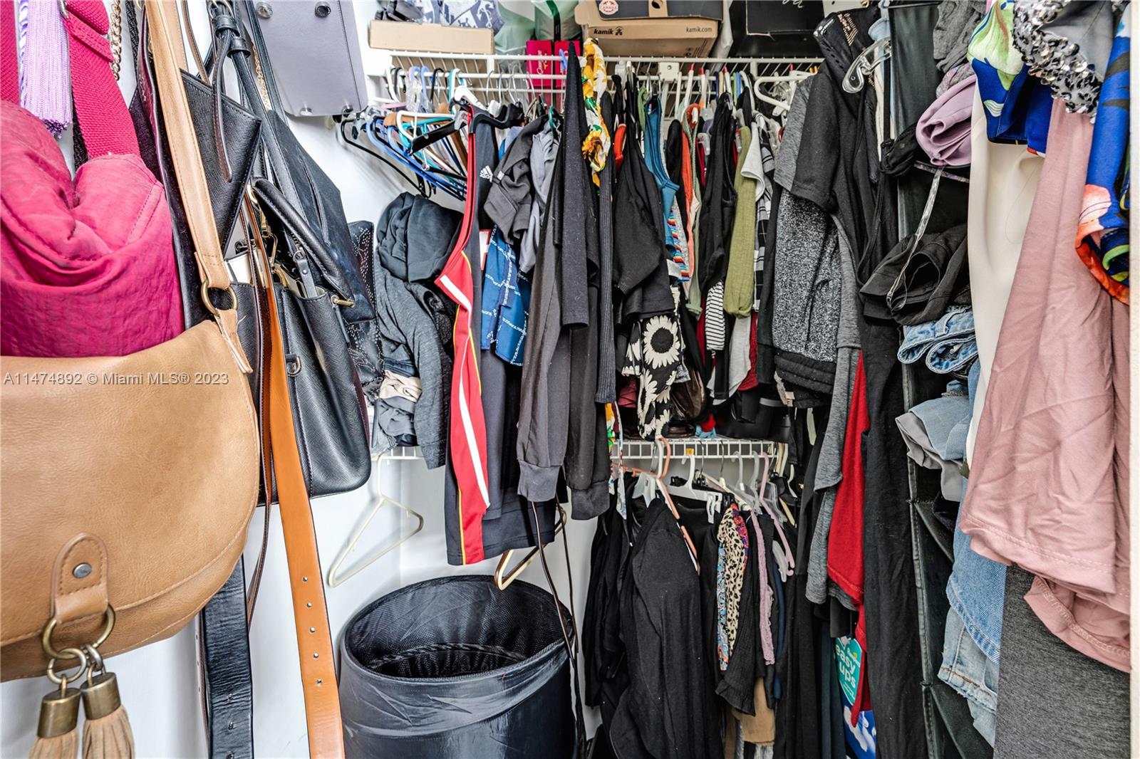 6825 Southwest 45th Lane, Unit 1 Miami, FL 33155 - Photo 18 of 28 a view of walk in closet with clothes