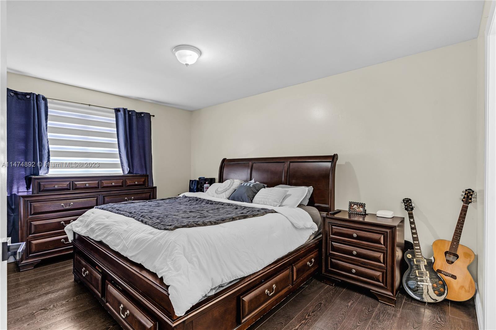 6825 Southwest 45th Lane, Unit 1 Miami, FL 33155 - Photo 20 of 28 a bedroom with a bed and a closet