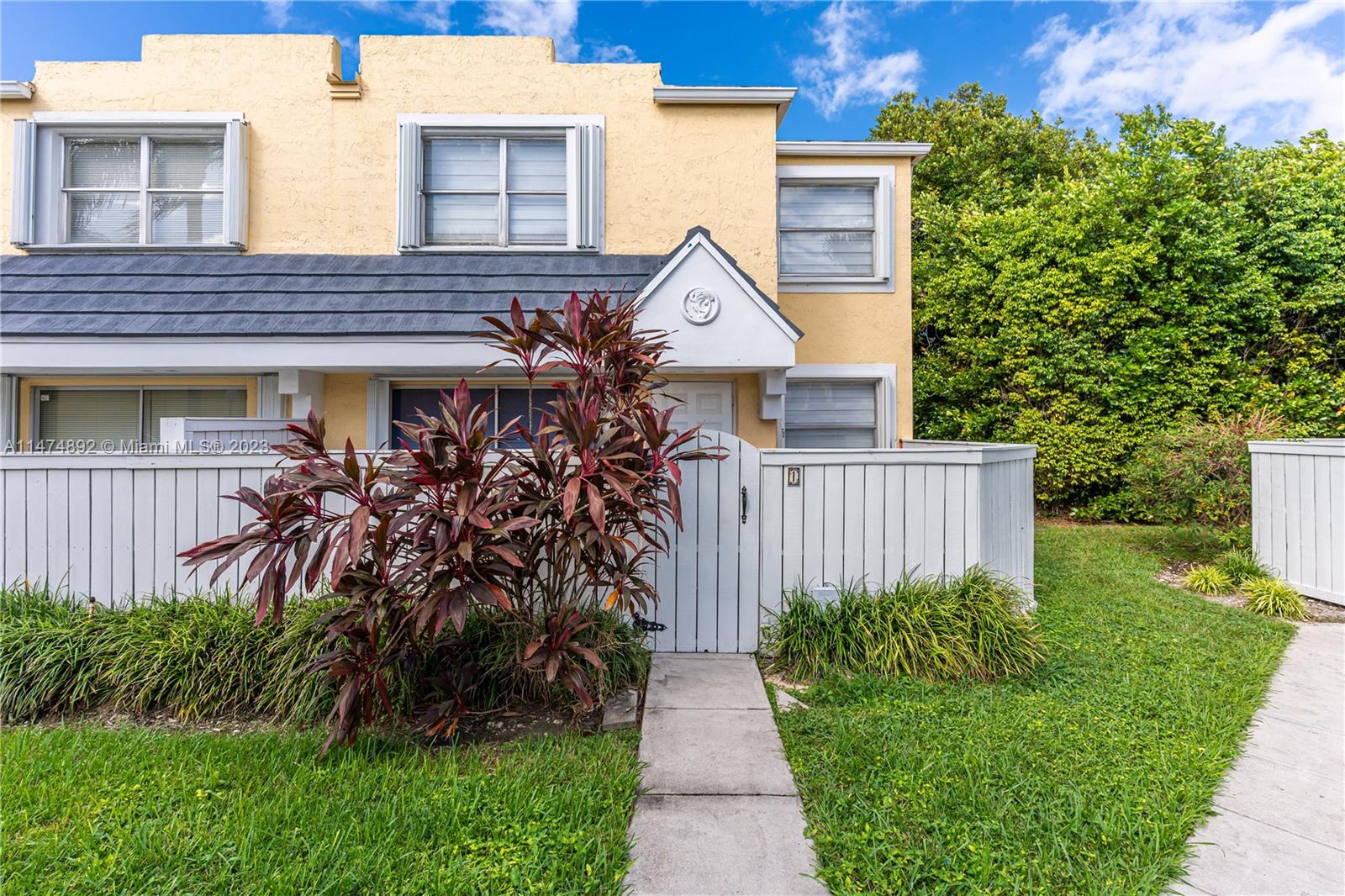6825 Southwest 45th Lane, Unit 1 Miami, FL 33155 - Photo 2 of 28 a house view with a garden space
