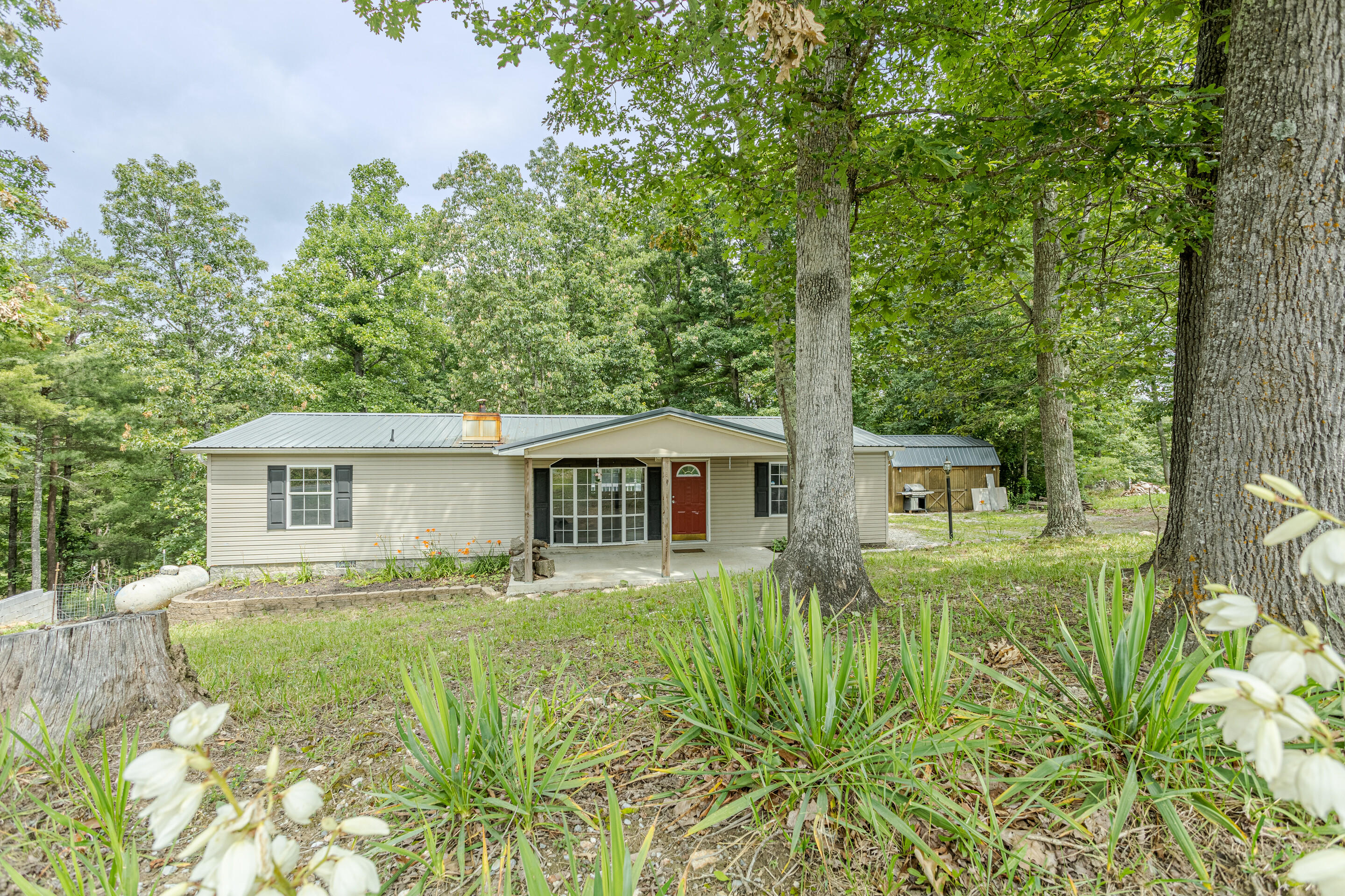 910 Dobbins Hollow Road Riner, VA 24149 - Photo 1 of 35 a front view of house with yard and green space