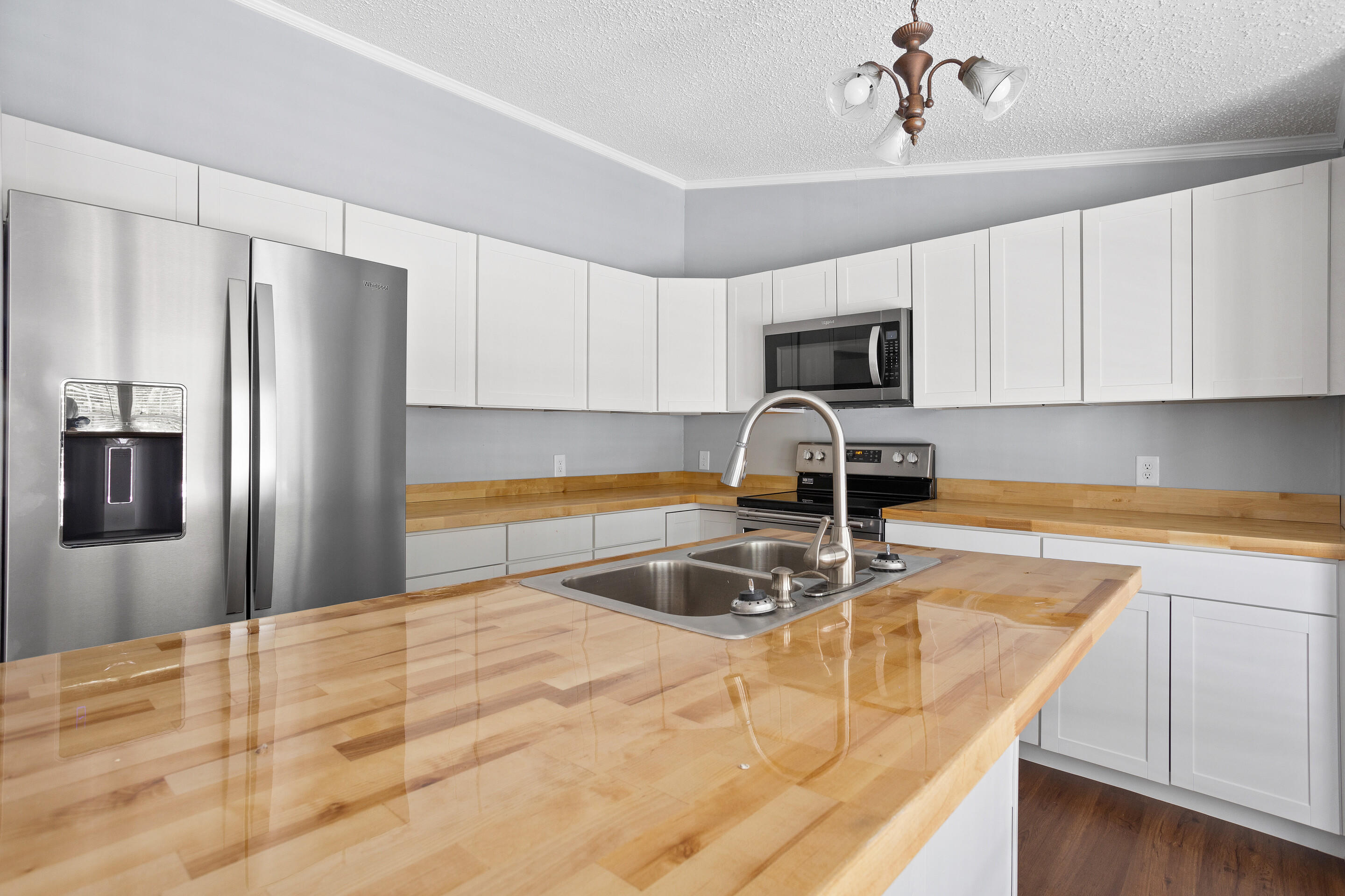 910 Dobbins Hollow Road Riner, VA 24149 - Photo 17 of 35 a kitchen with kitchen island a counter top space cabinets and stainless steel appliances