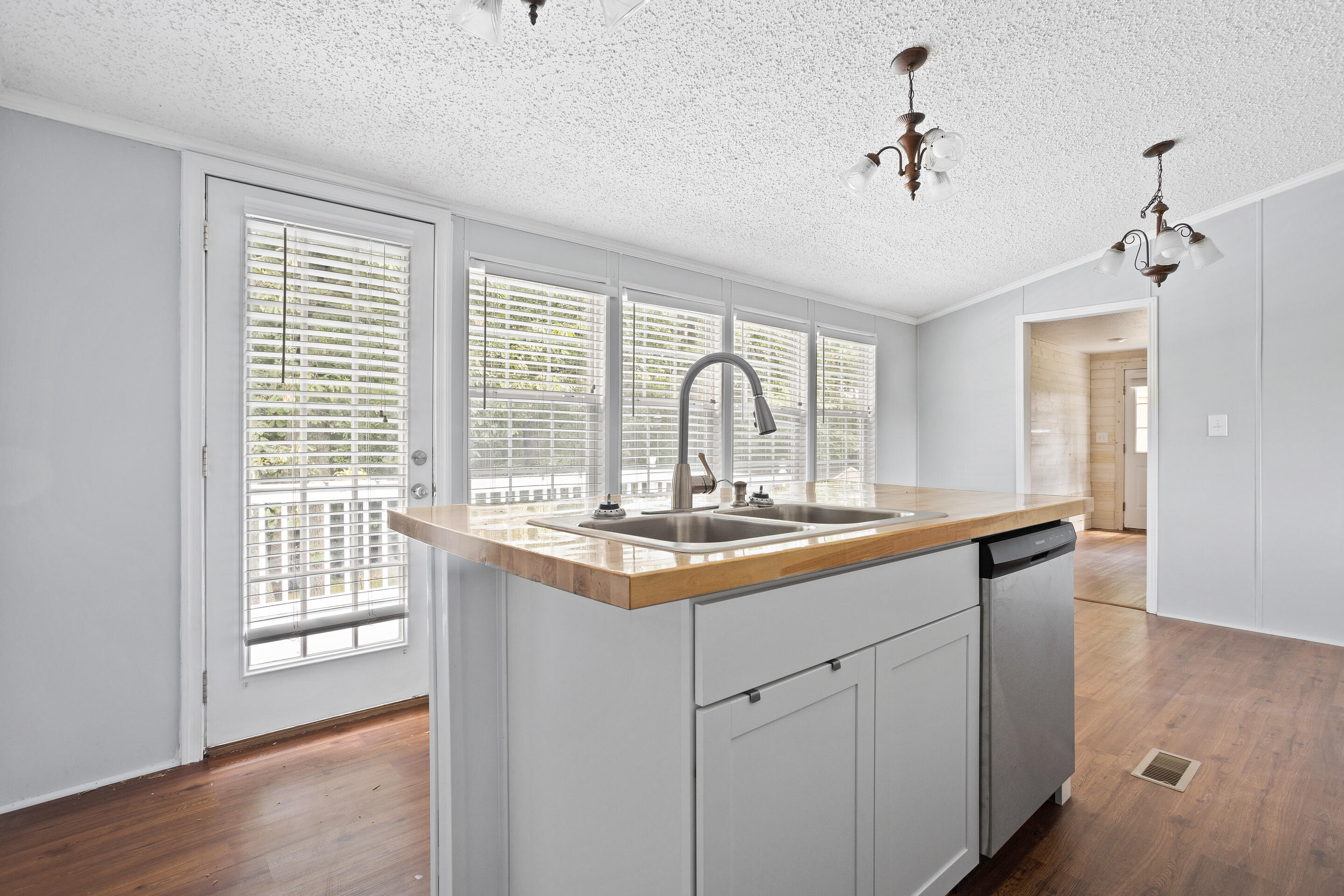 910 Dobbins Hollow Road Riner, VA 24149 - Photo 18 of 35 a kitchen with granite countertop a sink and cabinets