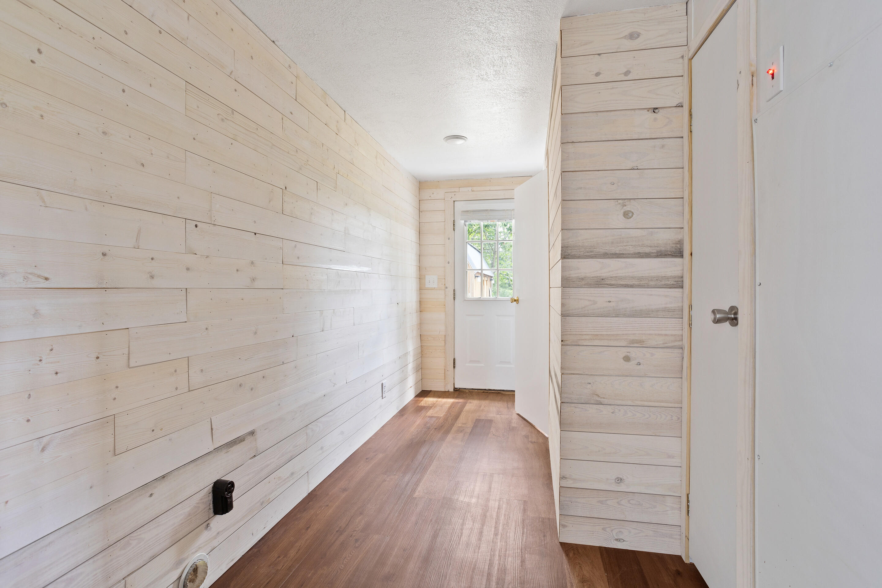910 Dobbins Hollow Road Riner, VA 24149 - Photo 23 of 35 wooden floor in an empty room