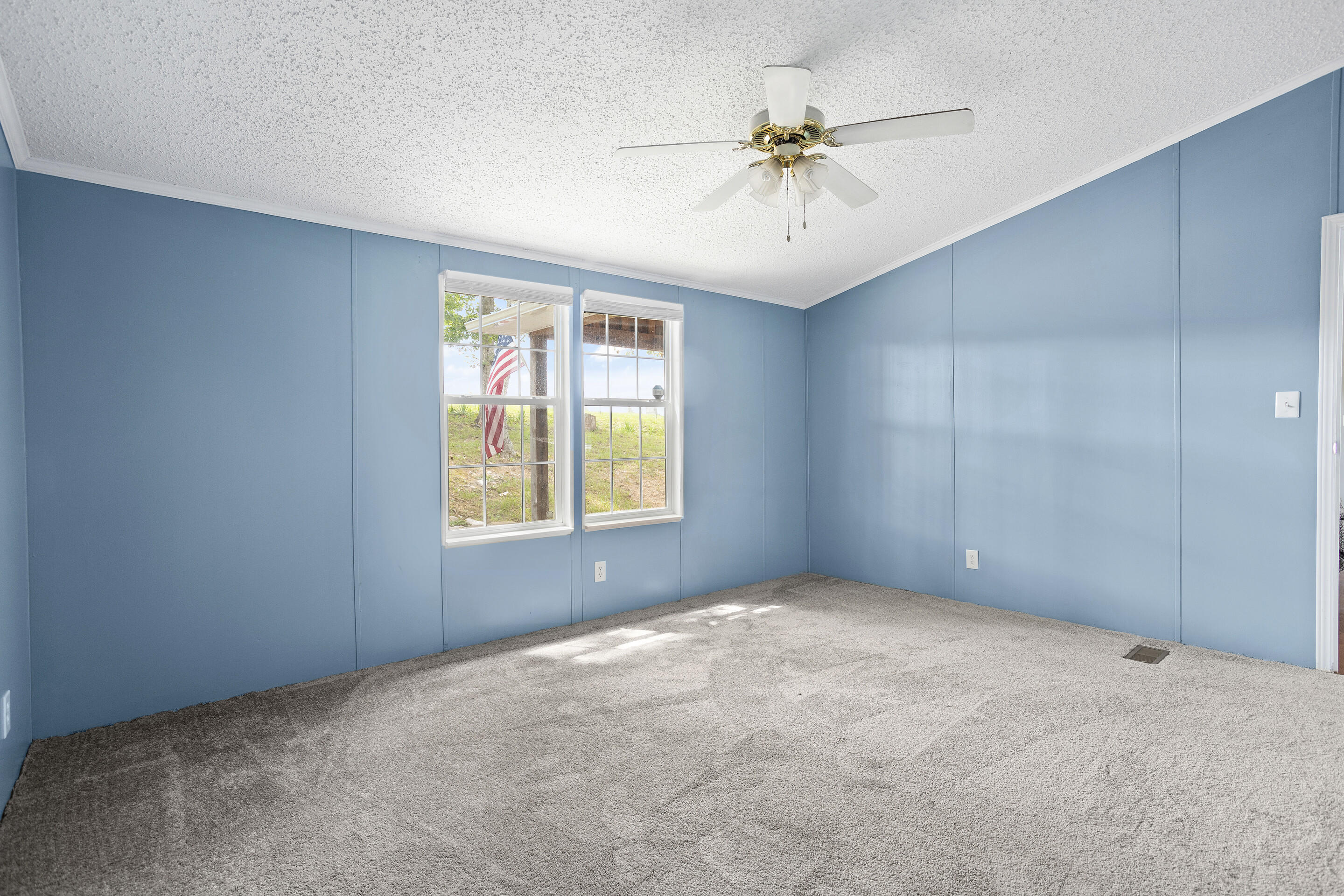 910 Dobbins Hollow Road Riner, VA 24149 - Photo 30 of 35 an empty room with windows and fan