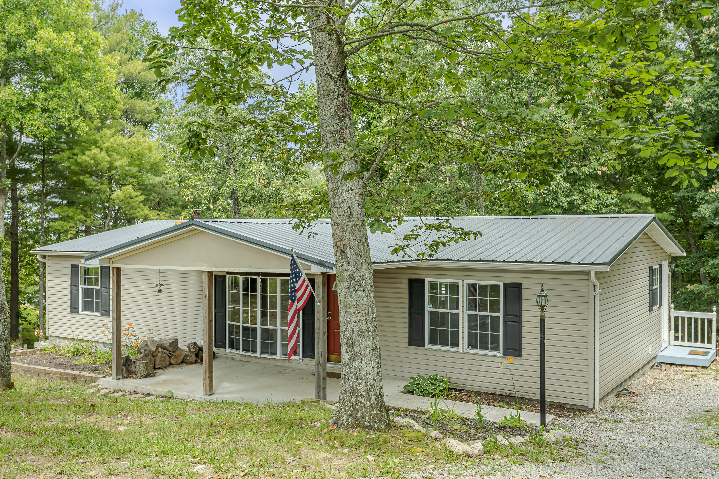 910 Dobbins Hollow Road Riner, VA 24149 - Photo 4 of 35 front view of a house with a yard
