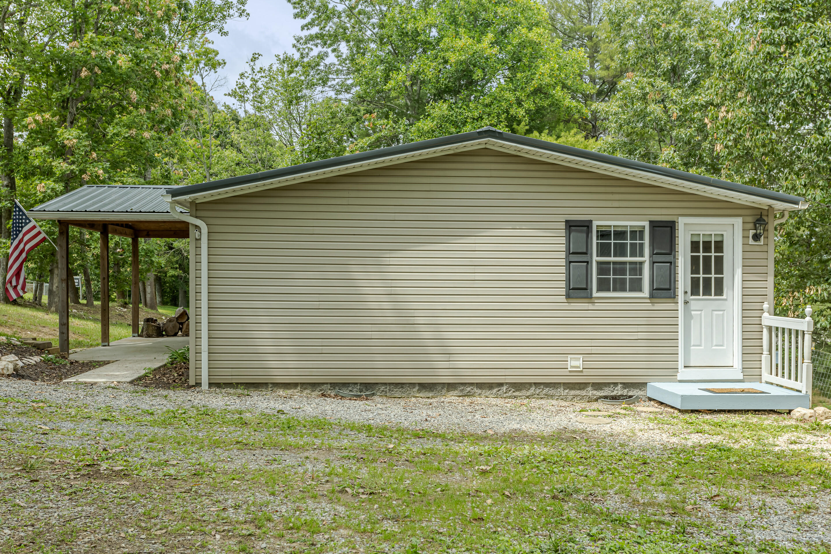 910 Dobbins Hollow Road Riner, VA 24149 - Photo 32 of 35 a front view of a house with garden