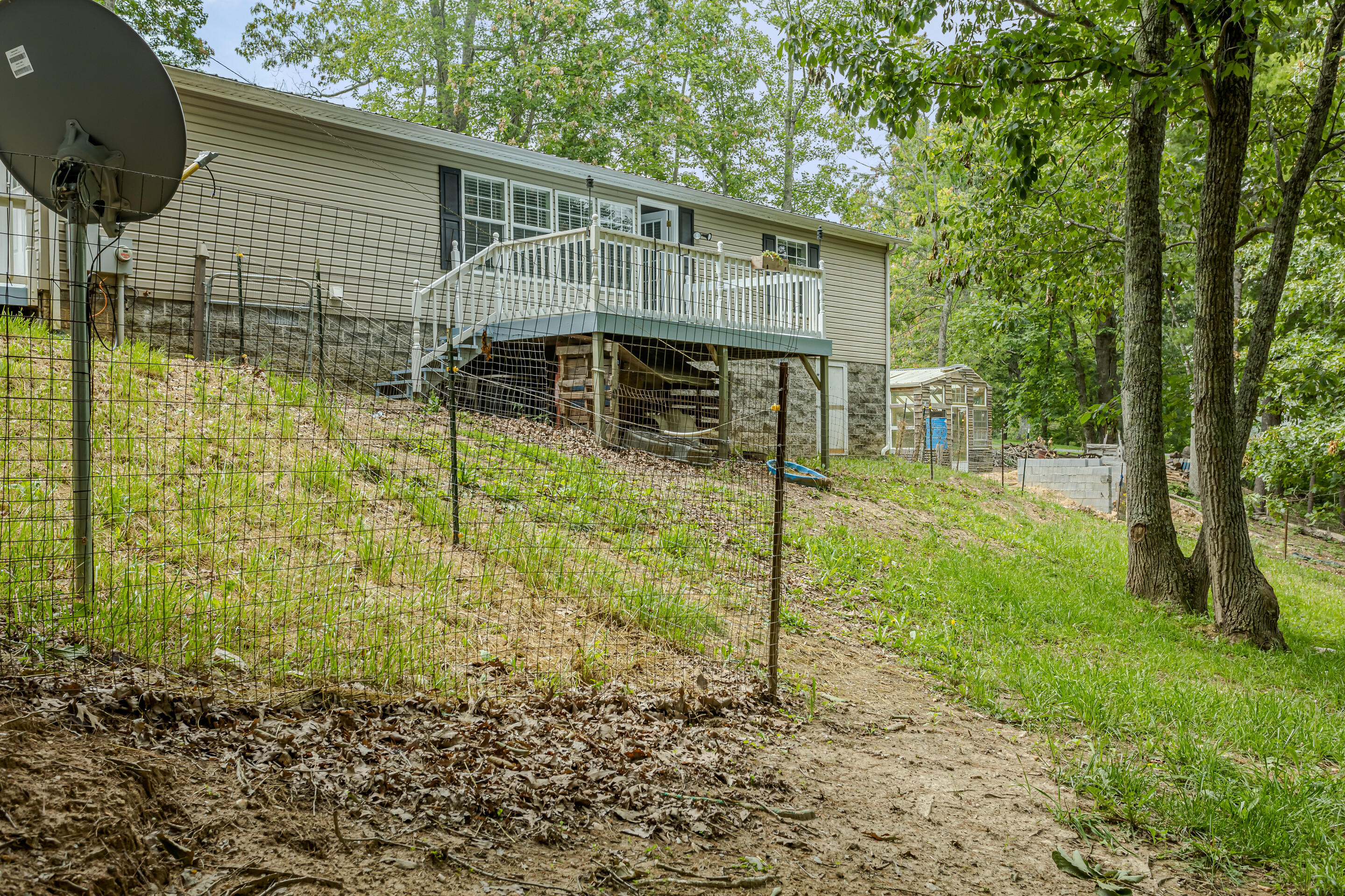 910 Dobbins Hollow Road Riner, VA 24149 - Photo 34 of 35 a backyard of a house with lots of green space