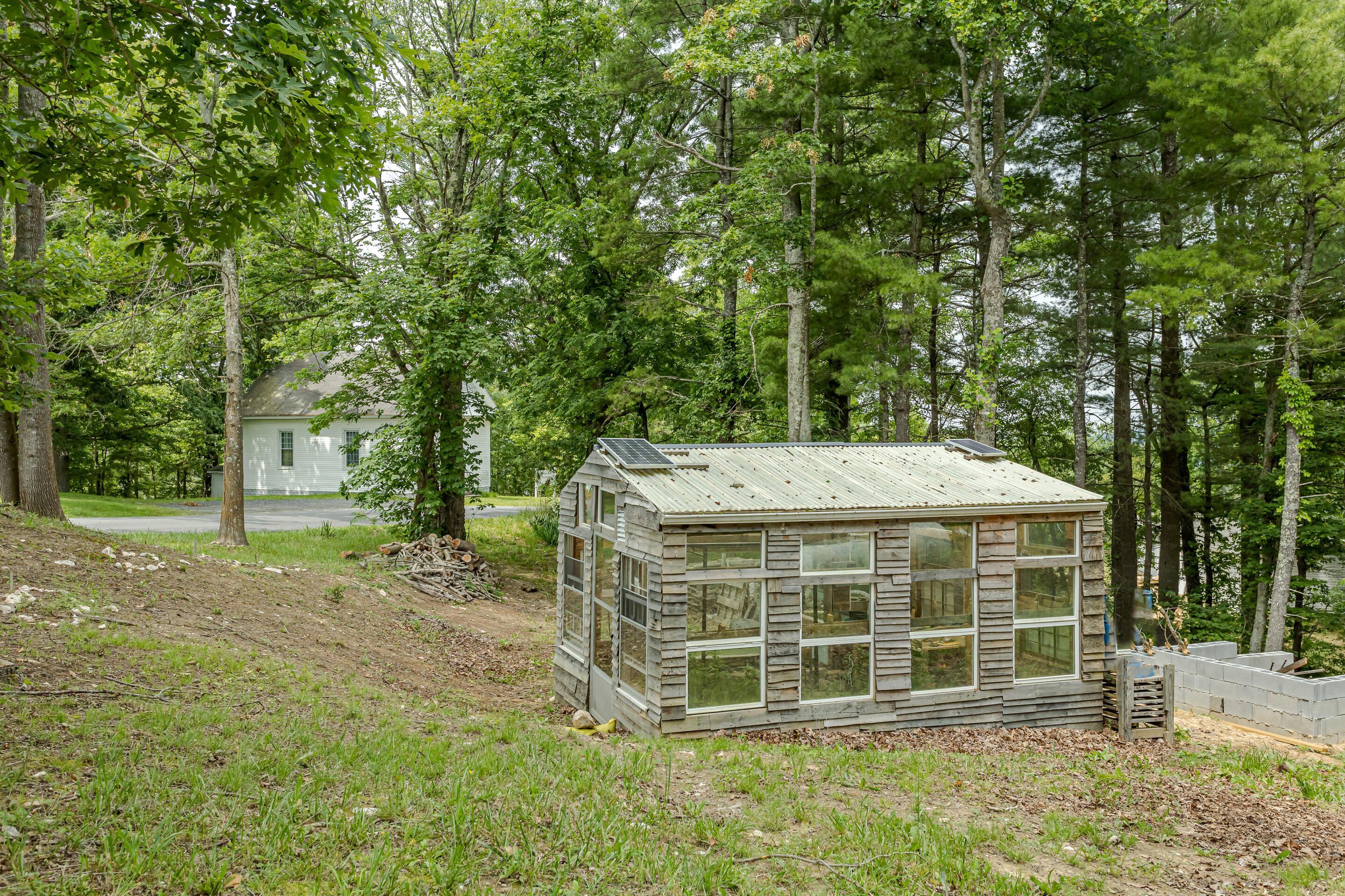910 Dobbins Hollow Road Riner, VA 24149 - Photo 35 of 35 a wooden house with trees in front of it