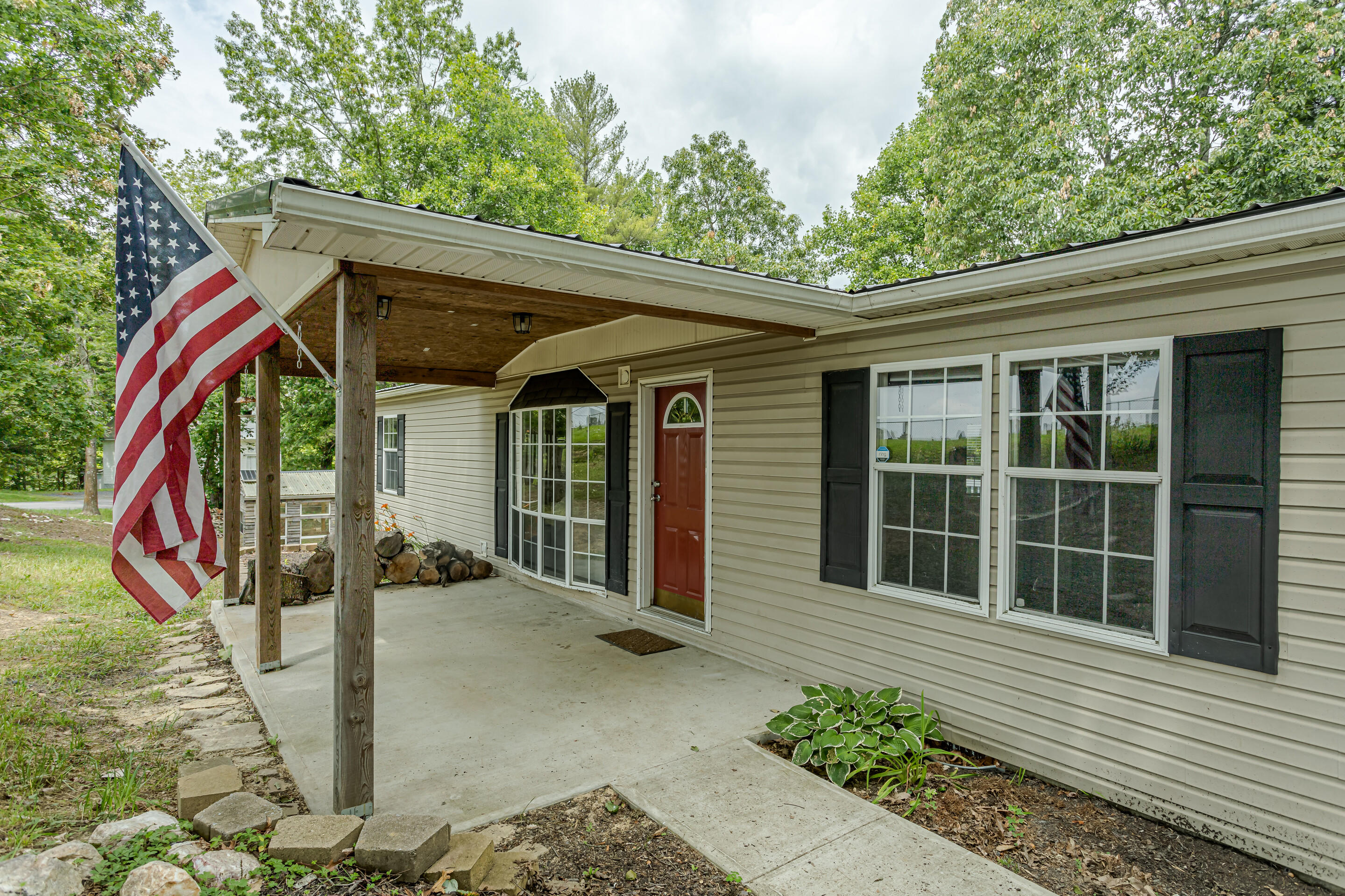910 Dobbins Hollow Road Riner, VA 24149 - Photo 5 of 35 a view of a house with a large window and plants