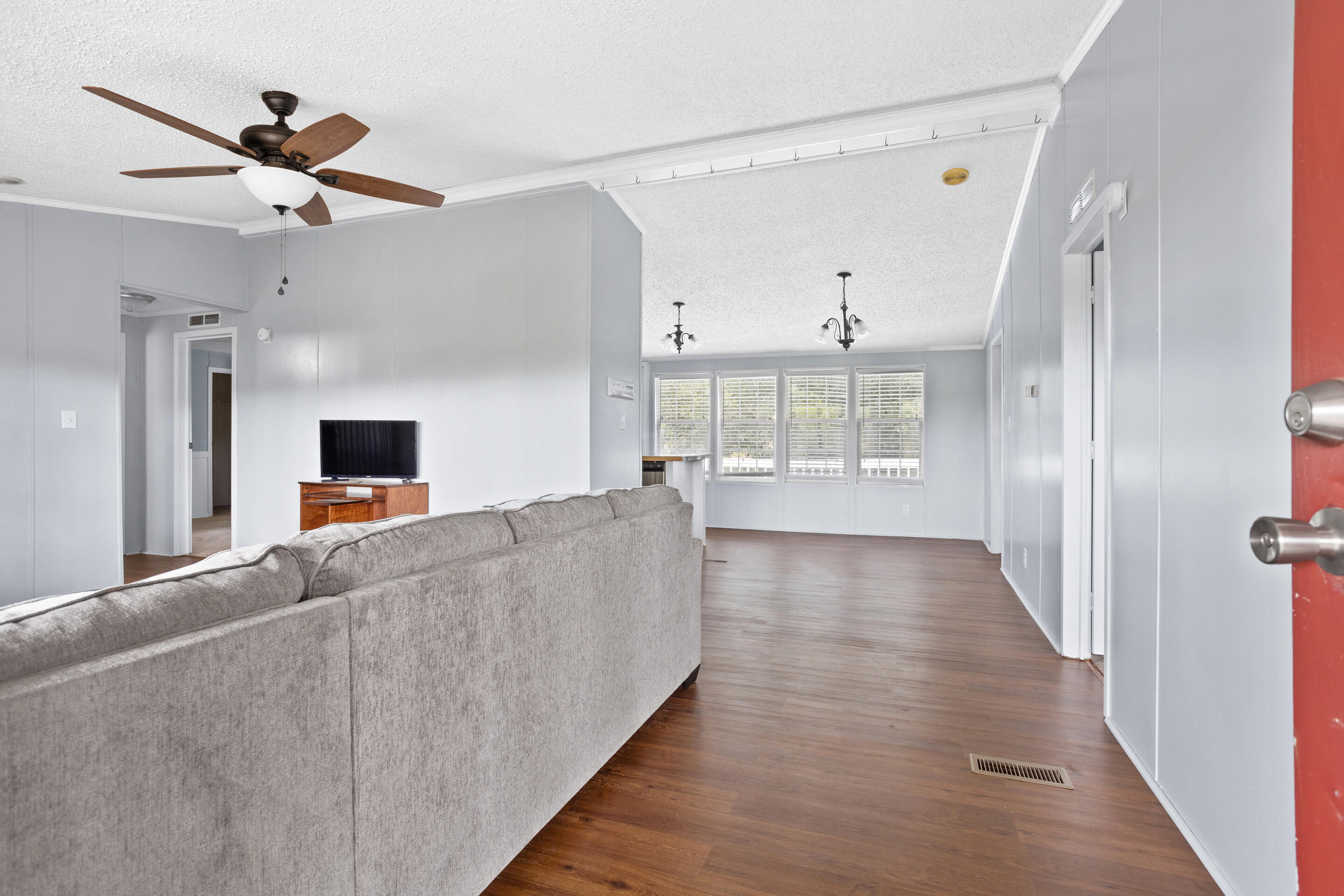 910 Dobbins Hollow Road Riner, VA 24149 - Photo 6 of 35 a view of a living room with wooden floor and a window