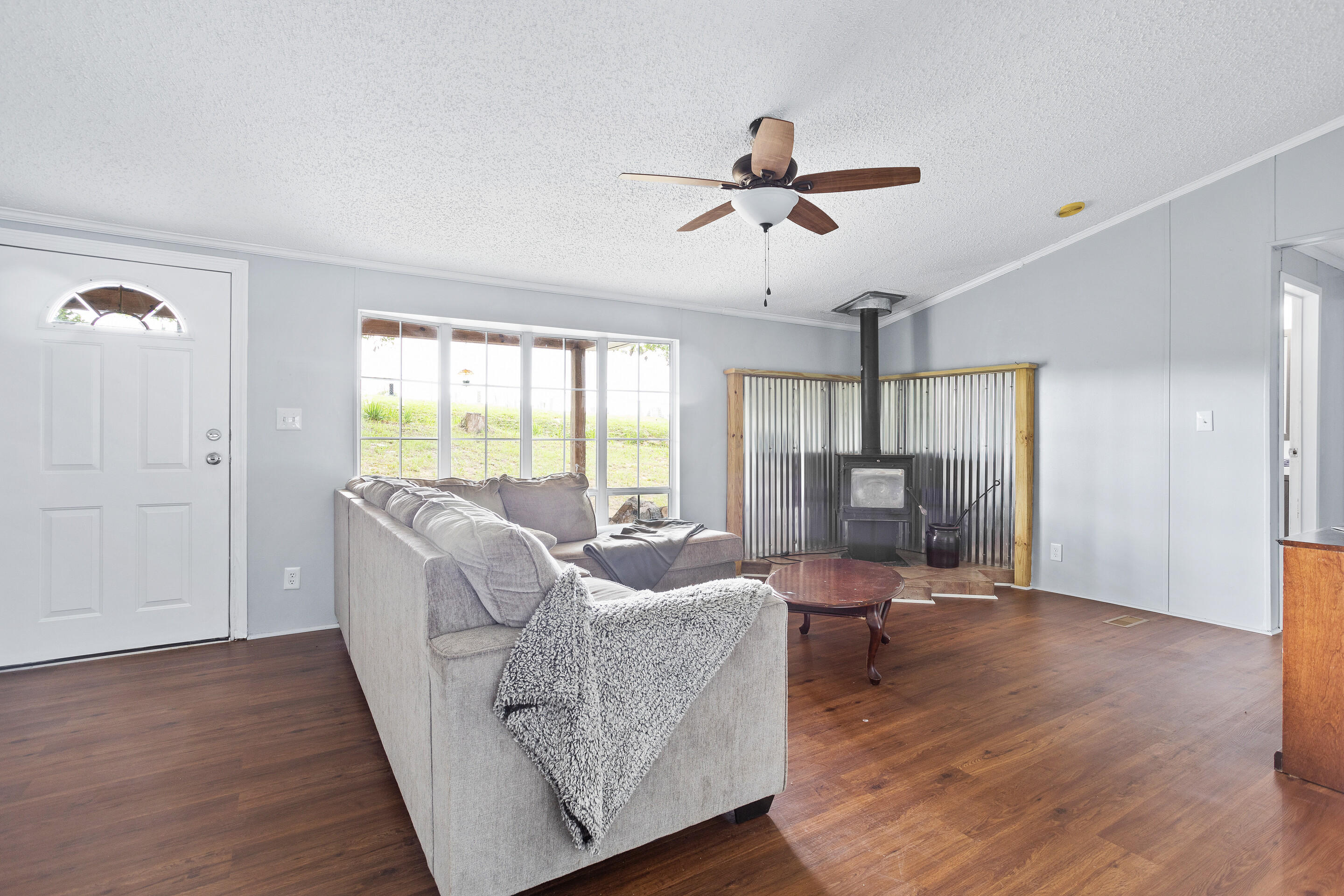 910 Dobbins Hollow Road Riner, VA 24149 - Photo 7 of 35 a living room with furniture and a large window