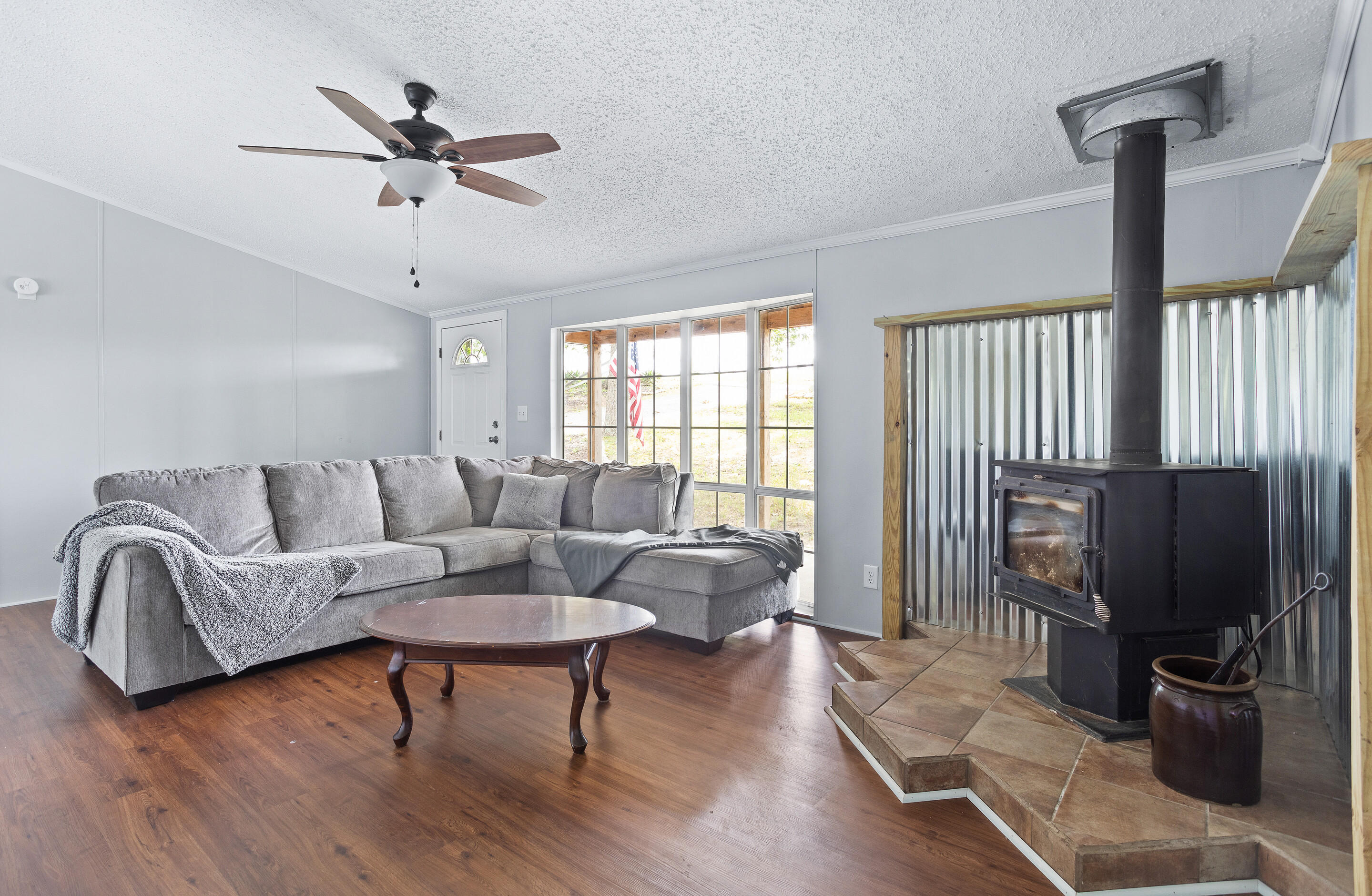 910 Dobbins Hollow Road Riner, VA 24149 - Photo 8 of 35 a living room with furniture ceiling fan and a wooden floor
