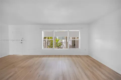 a kitchen with stainless steel appliances a stove sink and cabinets