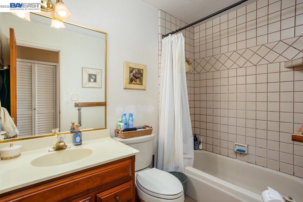 4591 Edwards Lane Castro Valley, CA 94546 - Photo 22 of 44 a bathroom with a sink a toilet and shower