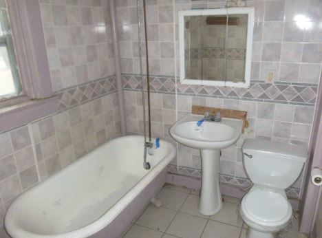 1411 North 5th Street Springfield, IL 62702 - Photo 11 of 11 a bathroom with a sink toilet and shower
