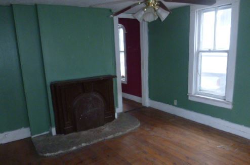 1411 North 5th Street Springfield, IL 62702 - Photo 5 of 11 a living room with a fireplace and a window