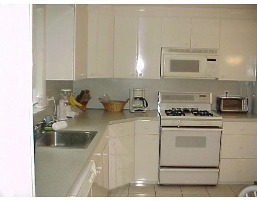 10 Jeffrey Road Canton, MA 02021 - Photo 4 of 16 a kitchen with granite countertop a sink a stove and cabinets