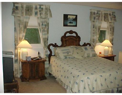10 Jeffrey Road Canton, MA 02021 - Photo 6 of 16 a bedroom with a bed and a painting on the wall