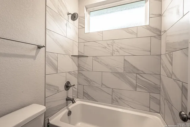 a bathroom with a bathtub