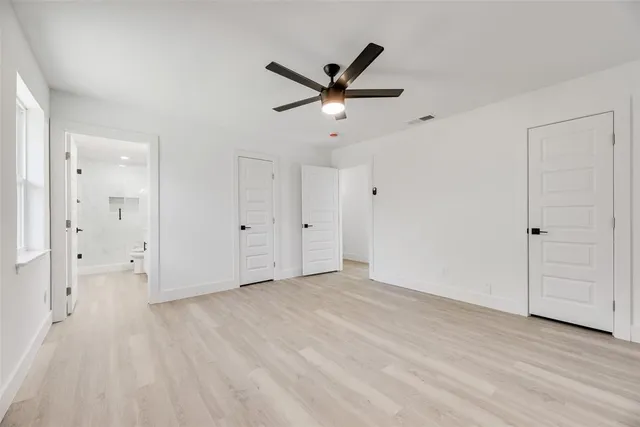 a bathroom with a double vanity sink toilet and shower