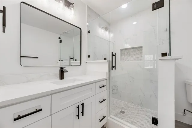 an empty room with a window and a ceiling fan