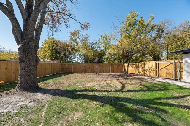 a bathroom with a shower sink and mirror